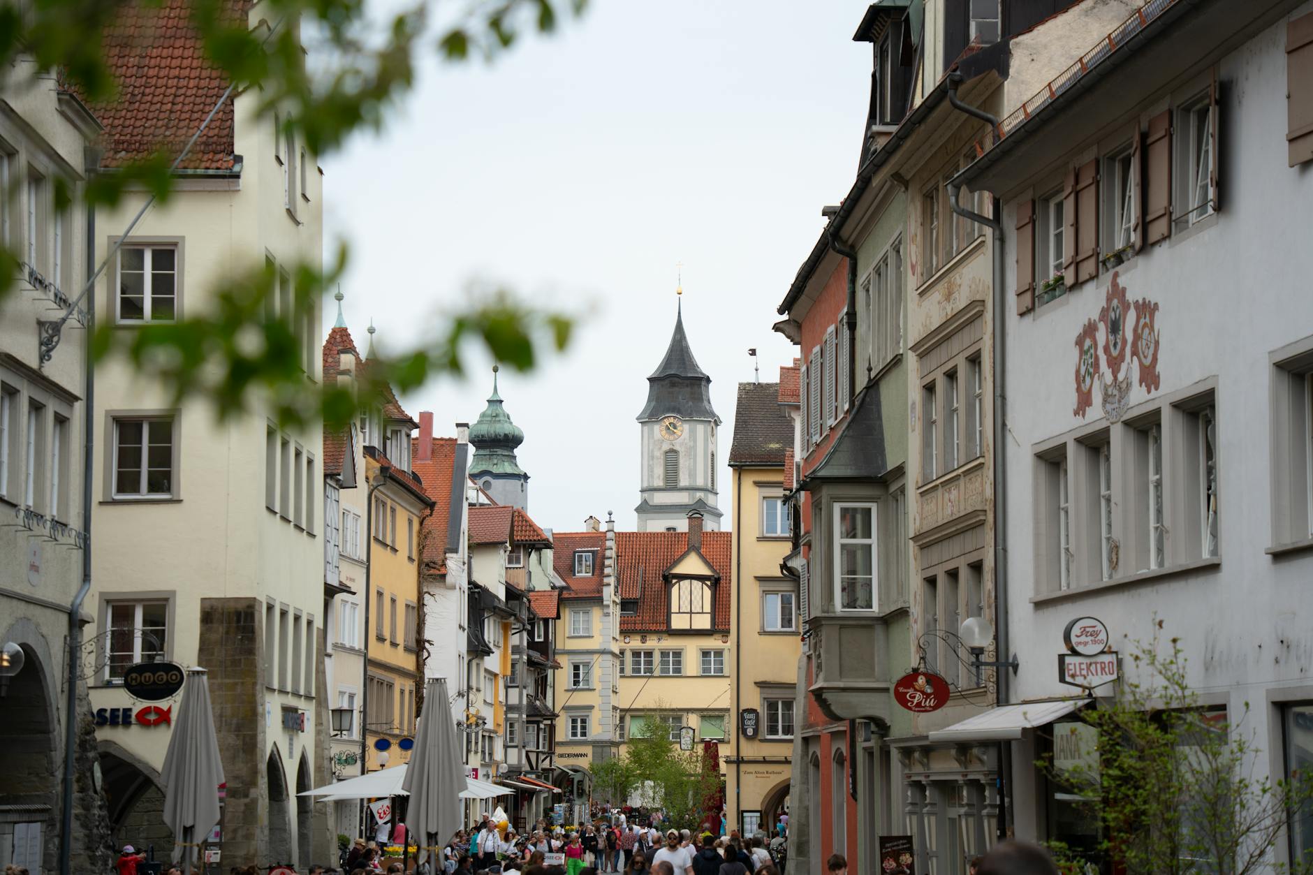 Explore the historic charm of Lindau's old town with its colorful buildings and bustling streets.