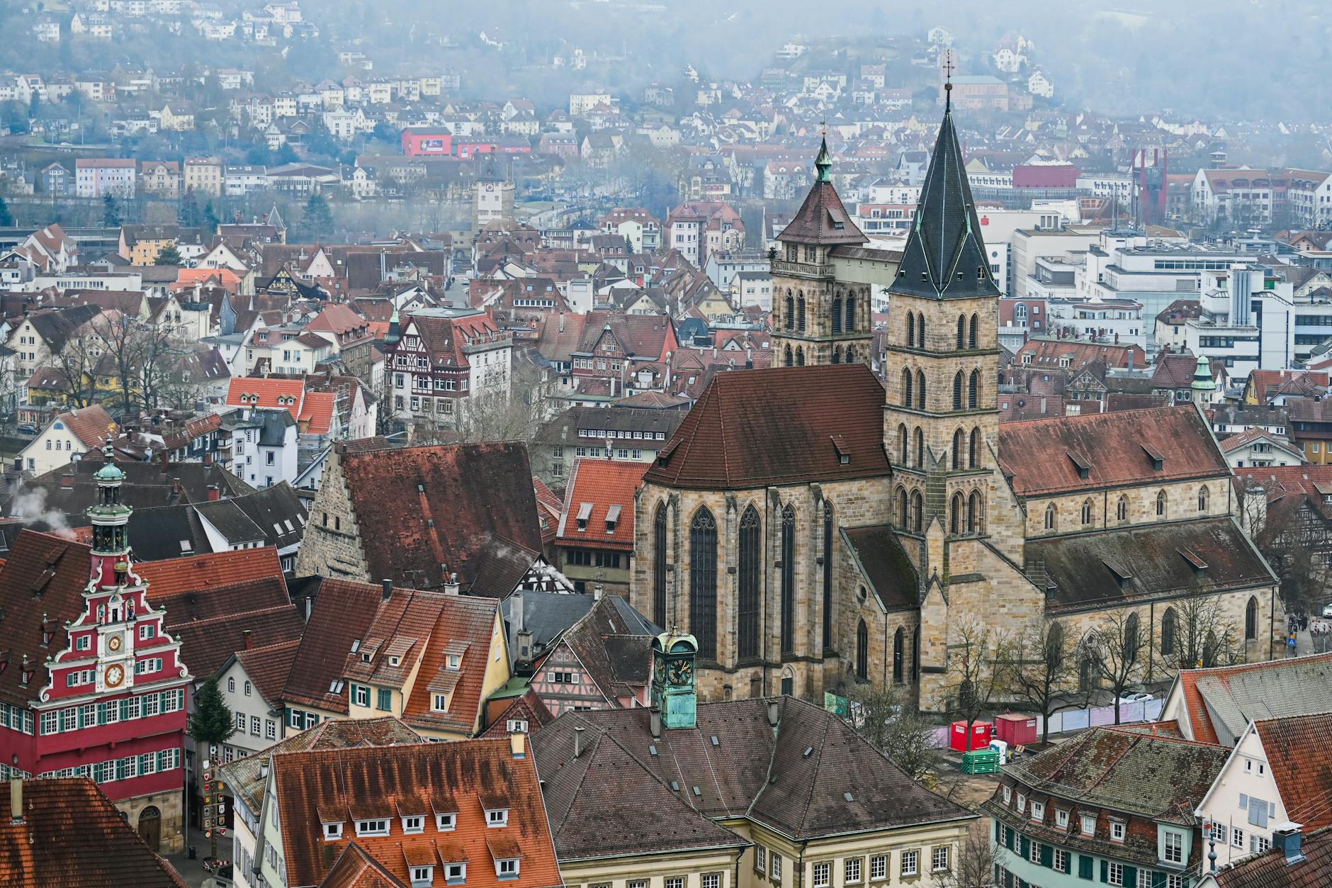 Aerial view of a historic German town featuring a prominent church and traditional architecture.