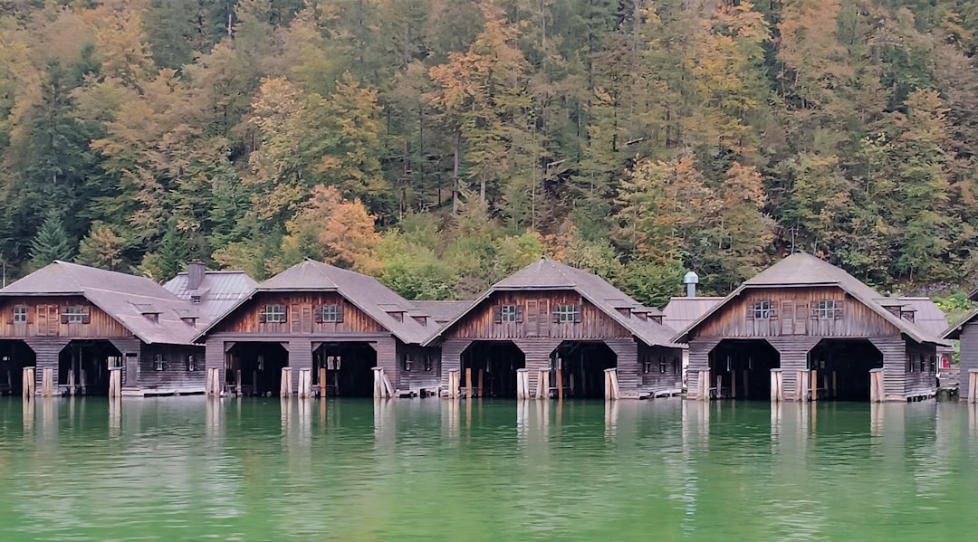 A row of wooden buildings sitting on top of a lake