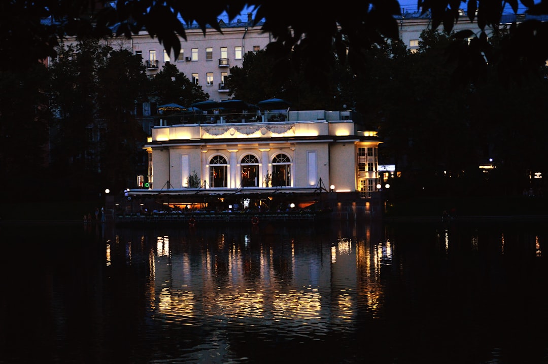 Building reflected in water at night